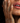 Womans hand on face, zoomed in on cheeks and lips, her hand is covered in the milo mask mixture